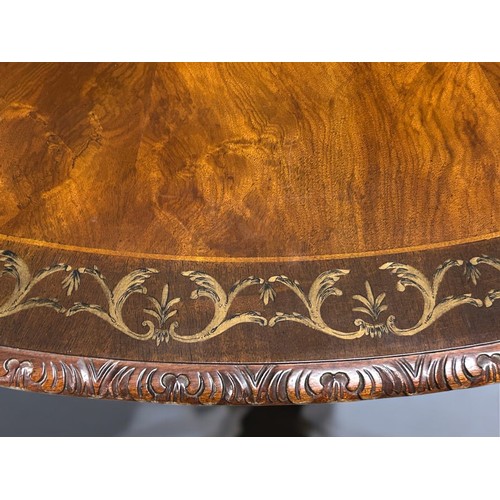 348 - A fine, large Mahogany centre table.Sunburst design top with inlaid stylised scrolling border. Acant... 