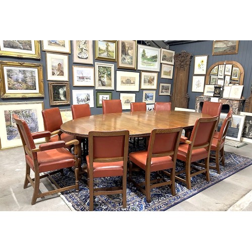 275A - Set of 12 mid century Oak chairs, leather upholstered and a matching boardroom table from the Univer... 