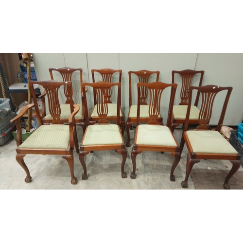 127 - Set of six mahogany dining chairs feature Chippendale-style backs and upholstered seats. They have c... 