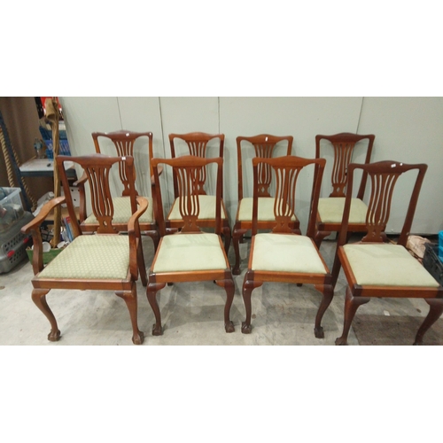 127 - Set of six mahogany dining chairs feature Chippendale-style backs and upholstered seats. They have c... 