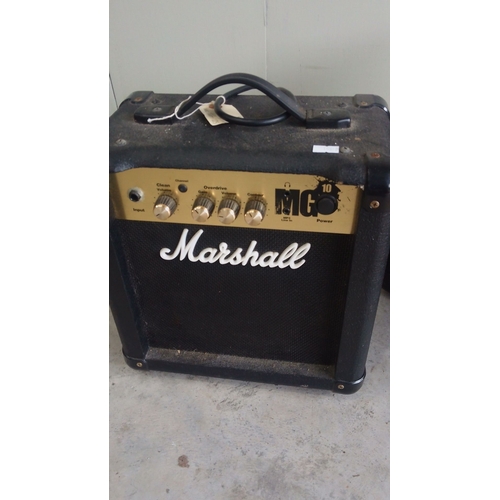 121 - Marshall MG15DFX guitar amplifier and Peavey MicroBass amp have rugged builds.