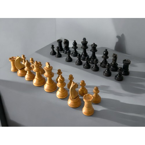 45 - An Early 20thC carved wooden chess set.