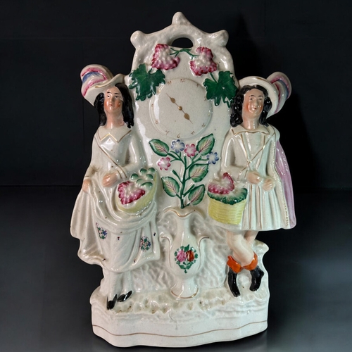 132 - Two large 19th century Staffordshire flatback clock face figures. Fruit sellers.Tallest Height - 33c... 