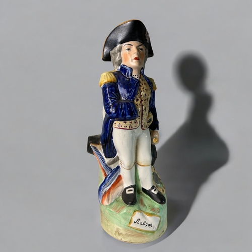 141 - Two large Staffordshire figures.19th century.Including Nelson figural Jug and Will Watch.Tallest - 3... 