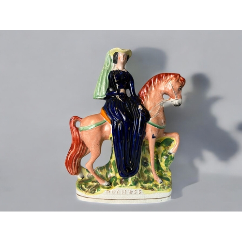 143 - A large 19th century Staffordshire 'Duchess' Cambridge flatback figure. Together with Horse & Fo... 