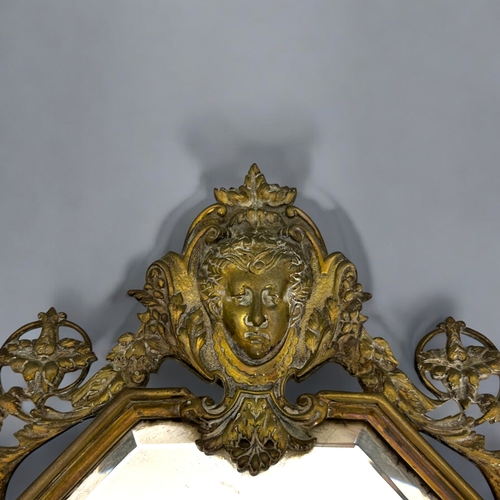 189 - A 19th century cast brass Girandole mirror. Late wired for electric lamps. Bevelled mirror. 52 x 30c... 