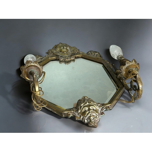 189 - A 19th century cast brass Girandole mirror. Late wired for electric lamps. Bevelled mirror. 52 x 30c... 