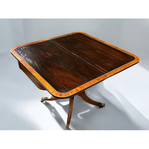 273 - A Regency period Mahogany inlaid folding tea table. Swivel and fold over action. Turned column on ra... 