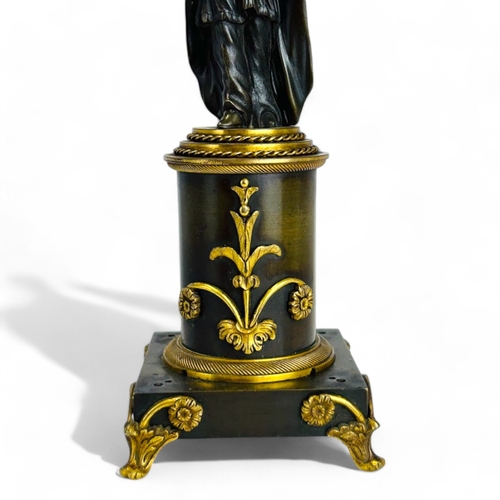 330 - A Charles X Gilt and Patinated bronze Chinoiserie candlestick. French, 1st quarter 19th century. Hei... 