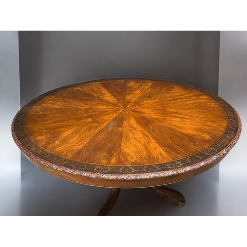 348 - A fine, large Mahogany centre table. Sunburst design top with inlaid stylised scrolling border. Acan... 