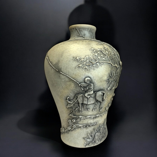 62 - A Chinese relief decorated biscuit porcelain vase. In the Wang Bingrong style. Height - 14cm