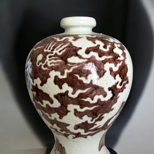 83 - A Chinese porcelain Meiping vase. Incised Dragon on white porcelain ground, with painted underglaze ... 