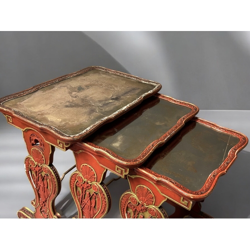 14 - A Chinese carved wood and Gesso nest of tables.Republic period, Circa 1920.Carved scenes in cinnabar... 