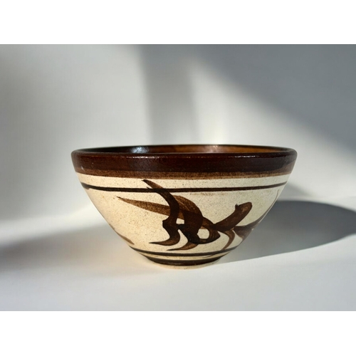 19 - A Chinese Cizhou ware bowl.20th century. Exterior painted in foliate design, with petal design to in... 