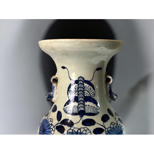 2 - A Chinese Celadon porcelain vase.Qing dynasty, 19th century.Twin Fo Dog handles, with blue & whi... 