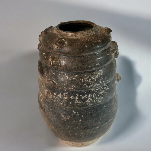 20 - A Chinese stoneware Yuan style brown glazed vase.Probably Qing dynasty.Ribbed body with relief Drago... 