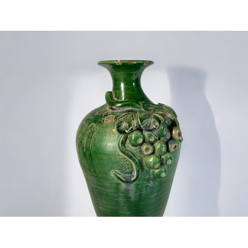 4 - A Chinese green glaze monochrome vase.In the Song style, Qing Dynasty.Relief decorated with vine &am... 