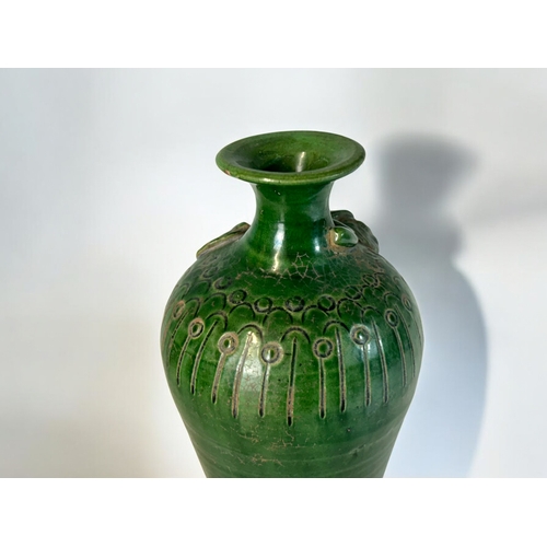 4 - A Chinese green glaze monochrome vase.In the Song style, Qing Dynasty.Relief decorated with vine &am... 