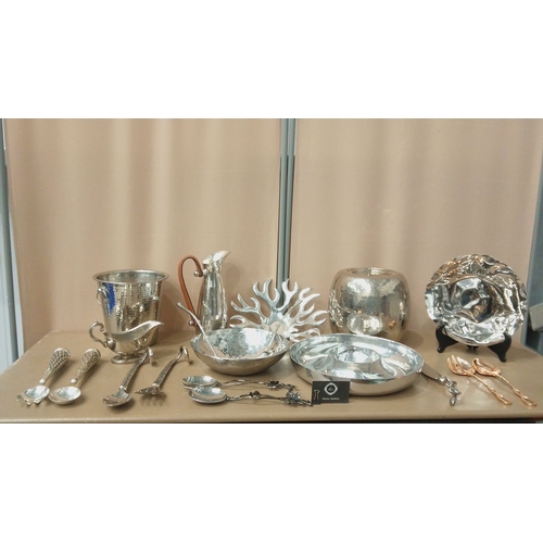 6 - Silver-plated tableware collection featuring embossed servers, hammered bowls, decorative spoons, an... 