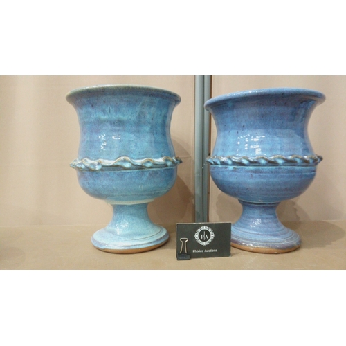 9 - Set of seven blue-glazed ceramic planters and bowls, featuring diverse shapes and intricate detailin... 