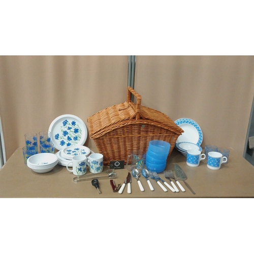 10 - Retro-style tableware Picnic set featuring floral dinner plates, mugs, bowls, and tumblers with blue... 