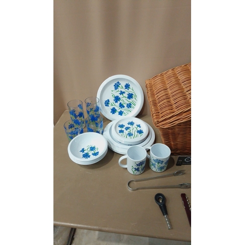 10 - Retro-style tableware Picnic set featuring floral dinner plates, mugs, bowls, and tumblers with blue... 