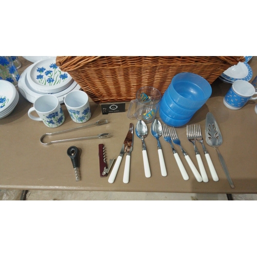 10 - Retro-style tableware Picnic set featuring floral dinner plates, mugs, bowls, and tumblers with blue... 