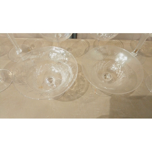 11 - Mixed set of 12 vintage etched glassware, featuring coupe and goblet styles. Timeless design with in... 