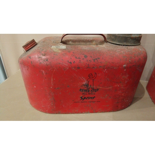 15 - Includes multiple red metal petrol cans, 