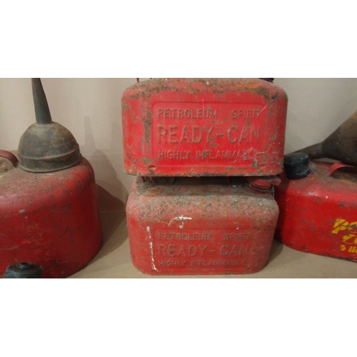 15 - Includes multiple red metal petrol cans, 