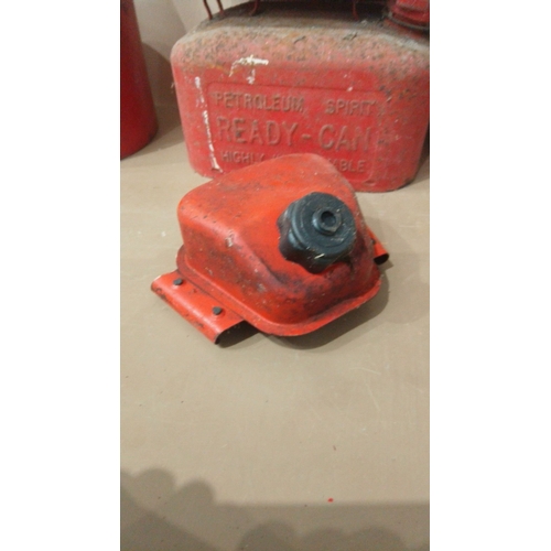 15 - Includes multiple red metal petrol cans, 