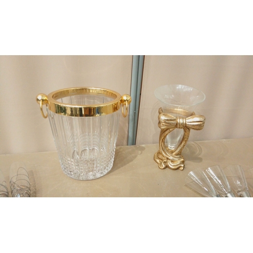 16 - Glass entertaining set, featuring a gold-rimmed ice bucket, gold-accented vase, and cocktail stirrer... 