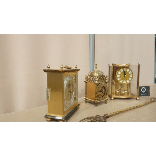 17 - Trio of brass carriage clocks from the late 20th century, featuring ornate dials and intricate detai... 