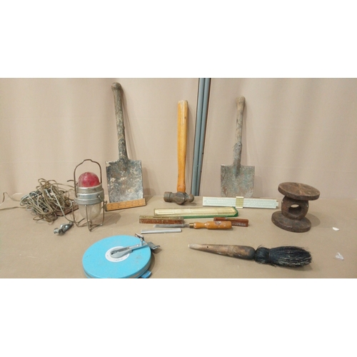 22 - Includes rulers, chisels, metal tape measure, and industrial light.