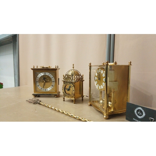 17 - Trio of brass carriage clocks from the late 20th century, featuring ornate dials and intricate detai... 