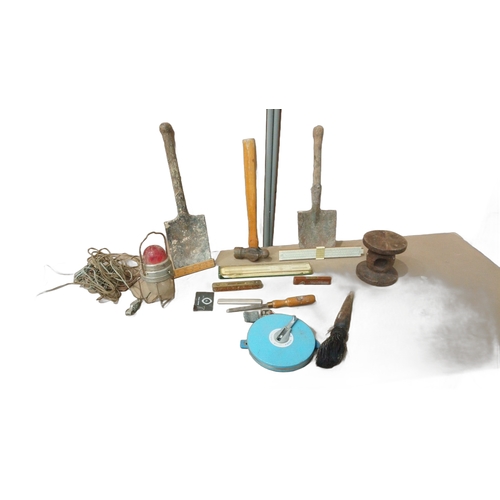 22 - Includes rulers, chisels, metal tape measure, and industrial light.