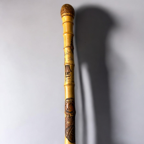 15 - A Japanese carved Bamboo walking stick.Meiji period, C 1900.Depicting Hotei on his sack, Rats and la... 