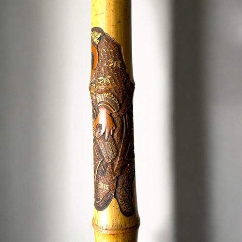 15 - A Japanese carved Bamboo walking stick.Meiji period, C 1900.Depicting Hotei on his sack, Rats and la... 