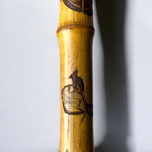 15 - A Japanese carved Bamboo walking stick.Meiji period, C 1900.Depicting Hotei on his sack, Rats and la... 
