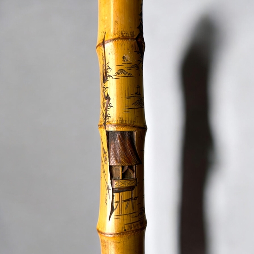 15 - A Japanese carved Bamboo walking stick.Meiji period, C 1900.Depicting Hotei on his sack, Rats and la... 