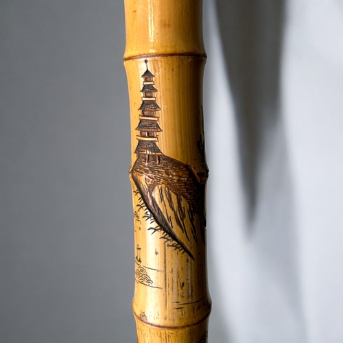 15 - A Japanese carved Bamboo walking stick.Meiji period, C 1900.Depicting Hotei on his sack, Rats and la... 