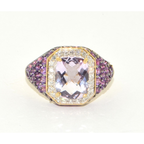 36 - 9ct gold ladies large set multi faceted centre stone with a Diamond set halo and Amethyst decorated ... 