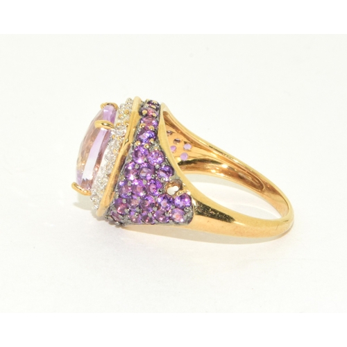 36 - 9ct gold ladies large set multi faceted centre stone with a Diamond set halo and Amethyst decorated ... 