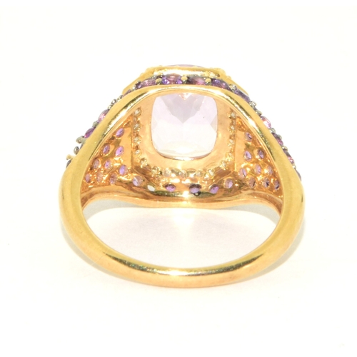 36 - 9ct gold ladies large set multi faceted centre stone with a Diamond set halo and Amethyst decorated ... 