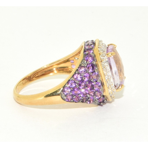 36 - 9ct gold ladies large set multi faceted centre stone with a Diamond set halo and Amethyst decorated ... 