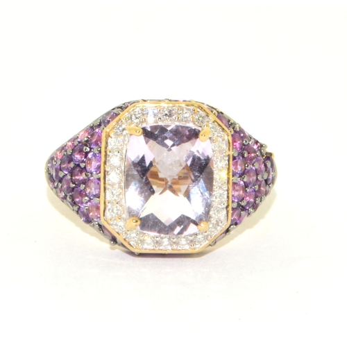 36 - 9ct gold ladies large set multi faceted centre stone with a Diamond set halo and Amethyst decorated ... 