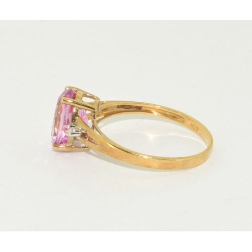 51 - 9ct gold ladies Pink Tourmaline ring with Diamond set shoulder in an open work setting size P