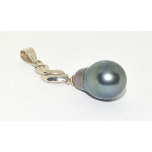 45 - Tahitian black pearl pendant held in a 925 silver TGGC setting 