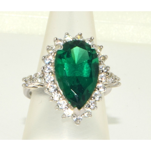 50 - 925 silver ladies Emerald green gem stone pear shape ring in a halo design set in an open claw setti... 