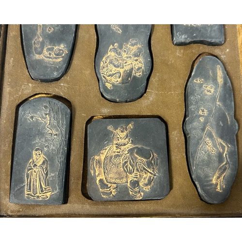 16 - A boxed set of nine Chinese Ink stones / cakes.Republic period.Maimo, depicting gilded Auspicious pi... 